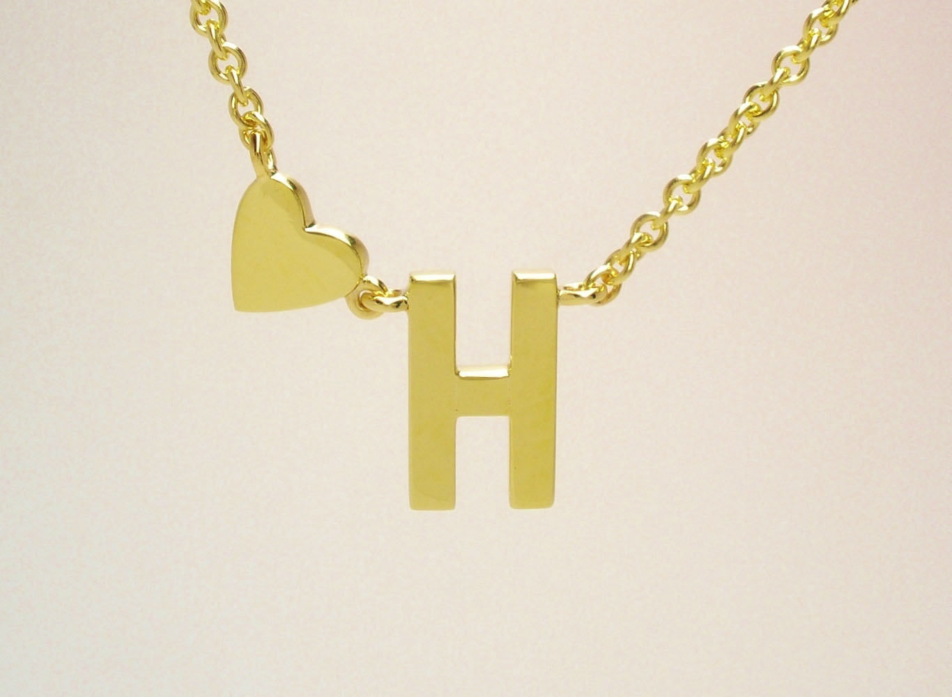 9ct. yellow gold initial 'H' and heart pendant created from a deceased family members wedding ring