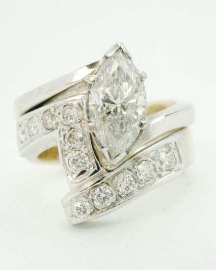 Single stone marquise cross-over ring showing the very untidy way the stone was set and the single stone marquise ring along with a very chunky, untidily set diamond shaped wedding ring.