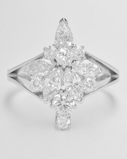 12 stone cluster mounted in platinum having used all the diamonds from both rings