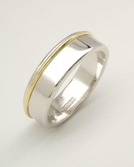 Gents 6mm broad flat sectioned platinum wedding ring with an 18ct. yellow gold round wire part recessed in from one edge.