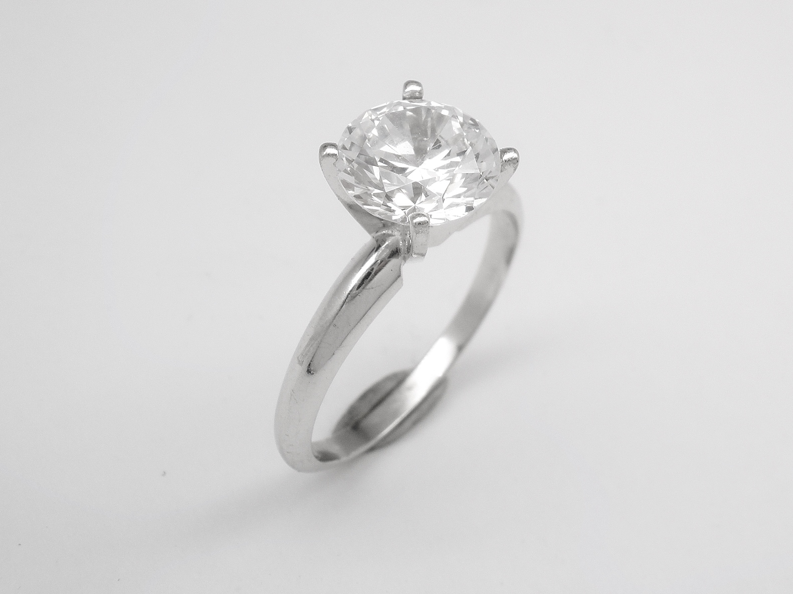 The original engagement ring mount had the 1.2ct. diamond set in 4 chunky claws and a shank that was low and broad where it was attached to the setting. This look did nothing to show off the diamond to its best effect.