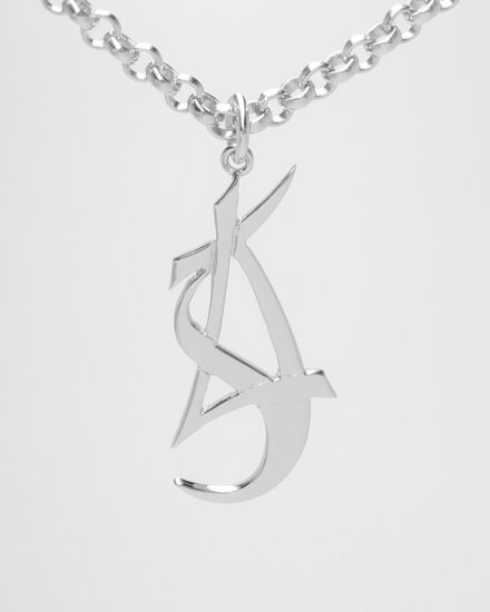 A 9ct. white gold stylised initial ' L, S, J ' pendant.
