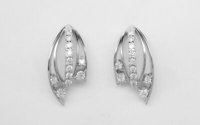 A pair of 9 stone round brilliant cut diamond earrings mounted in platinum.
