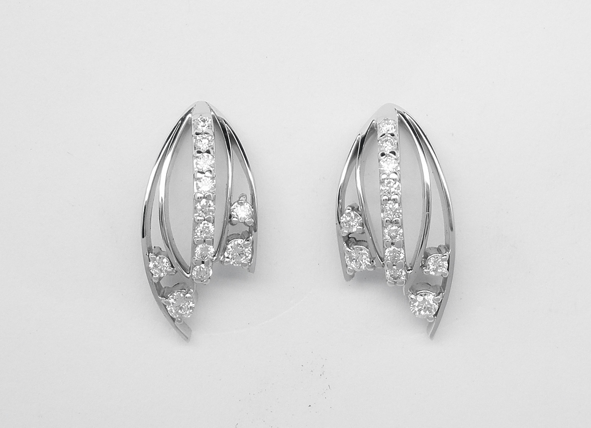 A pair of 9 stone round brilliant cut diamond earrings mounted in platinum.