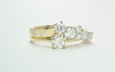 An 8 stone diamond ring mounted in 18ct. yellow gold and platinum shaped to fit with a single stone diamond ring.