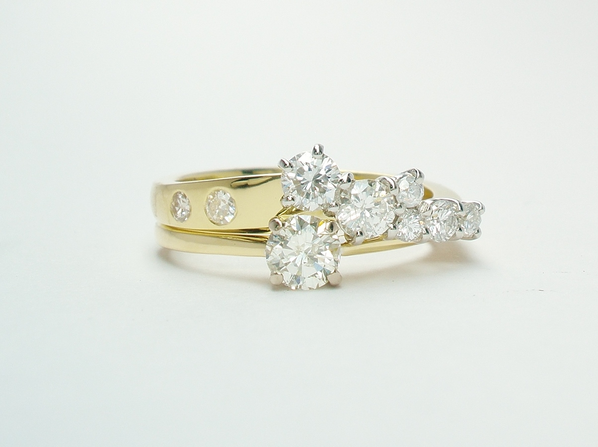 An 8 stone diamond ring mounted in 18ct. yellow gold and platinum shaped to fit with a single stone diamond ring.