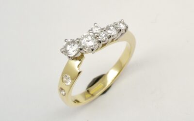 An 8 stone diamond ring mounted in 18ct. yellow gold and platinum shaped to fit with a single stone diamond ring.