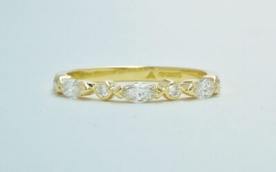 A 7 stone marquise cut and round brilliant cut diamond ring mounted in 18ct. yellow gold.