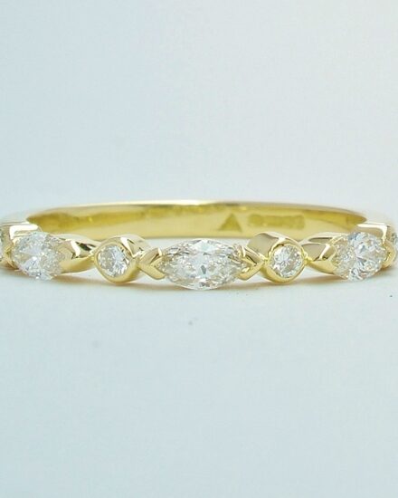 A 7 stone marquise cut and round brilliant cut diamond ring mounted in 18ct. yellow gold.
