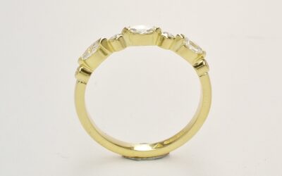 A 7 stone marquise cut and round brilliant cut diamond ring mounted in 18ct. yellow gold.