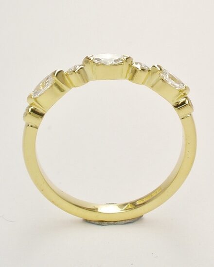 A 7 stone marquise cut and round brilliant cut diamond ring mounted in 18ct. yellow gold.