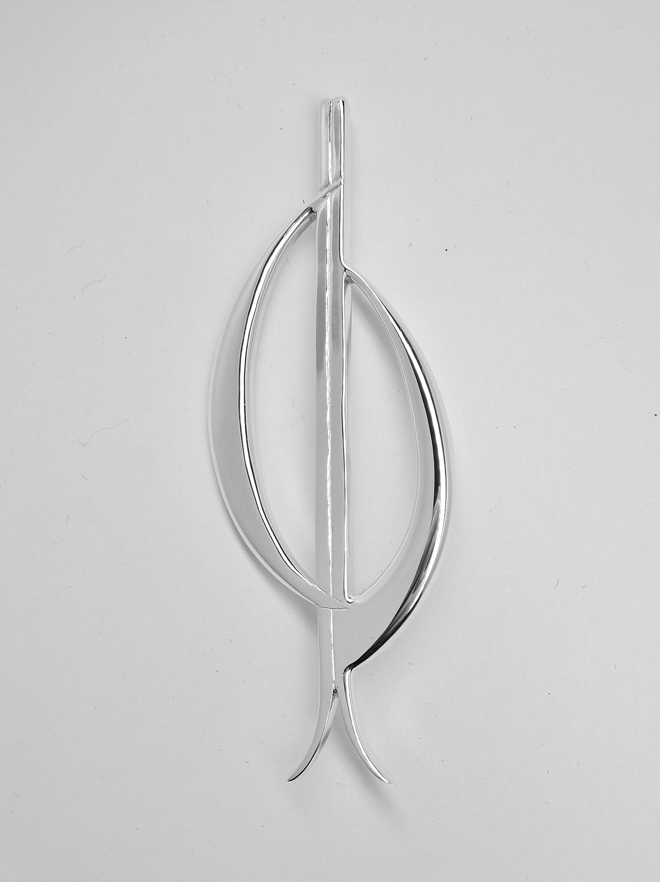 A sterling silver kilt pin depicting stylised initials C, J, B, a pair of skis and loosely a rugby ball.