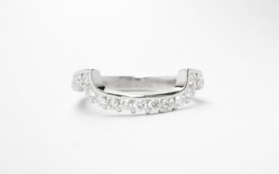 A 17 stone part channel set round brilliant cut diamond ring mounted in platinum & shaped to fit around a large 108 stone diamond cluster ring.