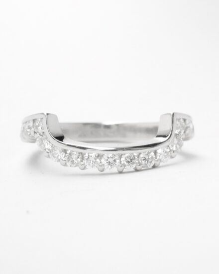 A 17 stone part channel set round brilliant cut diamond ring mounted in platinum & shaped to fit around a large 108 stone diamond cluster ring.