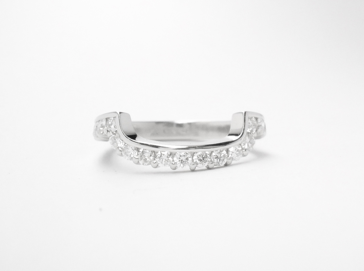 A 17 stone part channel set round brilliant cut diamond ring mounted in platinum & shaped to fit around a large 108 stone diamond cluster ring.