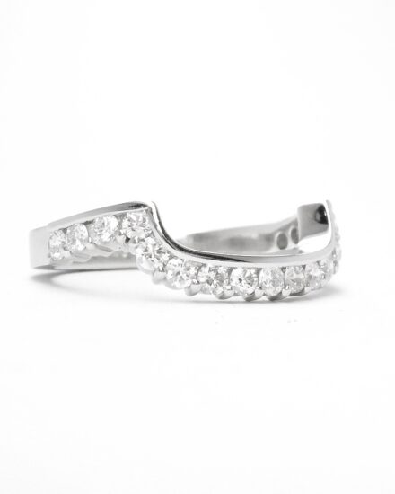 A 17 stone part channel set round brilliant cut diamond ring mounted in platinum & shaped to fit around a large 108 stone diamond cluster ring.