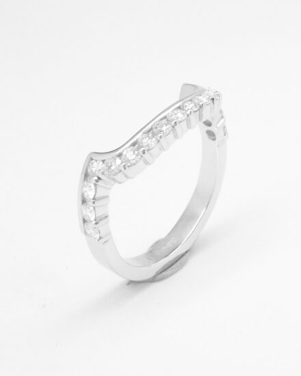 A 17 stone part channel set round brilliant cut diamond ring mounted in platinum & shaped to fit around a large 108 stone diamond cluster ring.