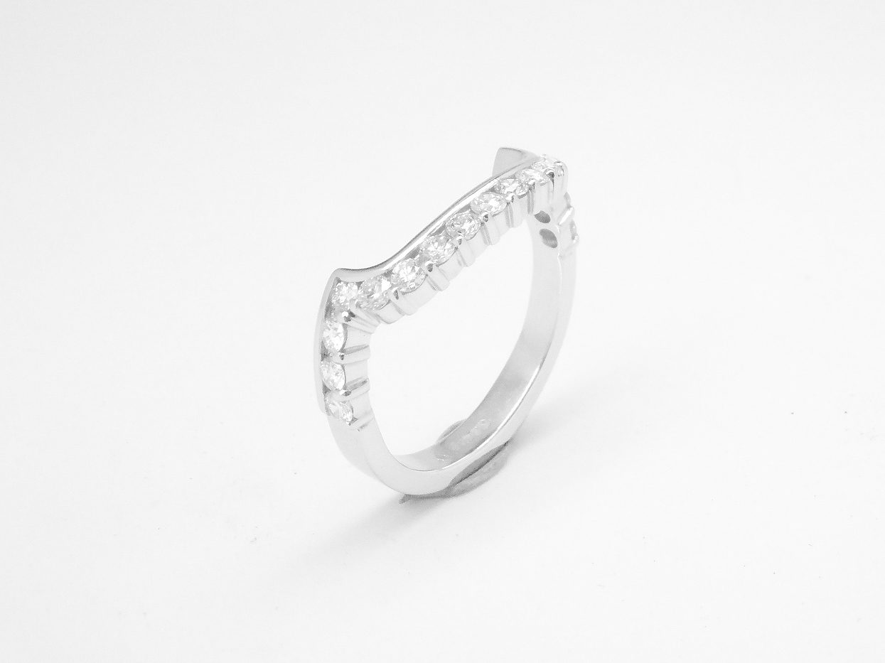 A 17 stone part channel set round brilliant cut diamond ring mounted in platinum & shaped to fit around a large 108 stone diamond cluster ring.