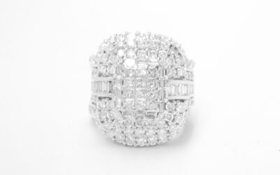 A 17 stone part channel set round brilliant cut diamond ring mounted in platinum & shaped to fit around a large 108 stone diamond cluster ring.