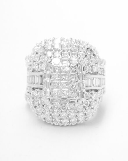 A 17 stone part channel set round brilliant cut diamond ring mounted in platinum & shaped to fit around a large 108 stone diamond cluster ring.