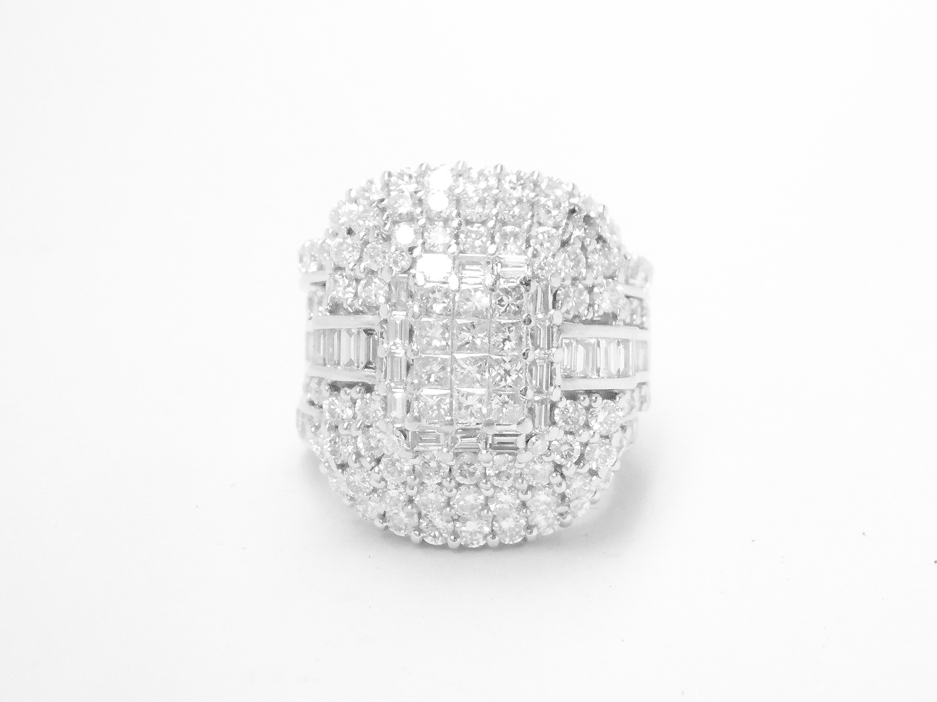 A 17 stone part channel set round brilliant cut diamond ring mounted in platinum & shaped to fit around a large 108 stone diamond cluster ring.