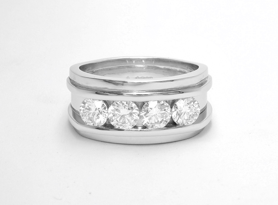 A 4 stone round brilliant cut diamond ring mounted in platinum