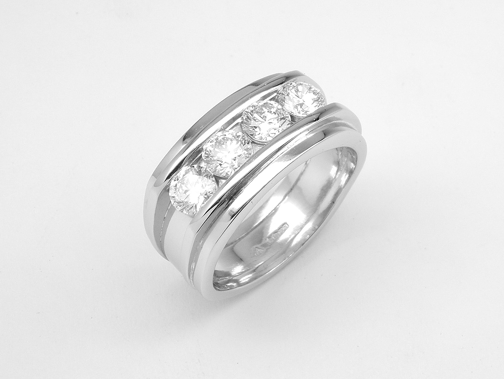 A 4 stone round brilliant cut diamond ring mounted in platinum