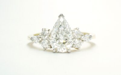 A 7 stone pear shaped, brilliant cut and marquise cut Lab grown diamond ring mounted in 18ct yellow gold and platinum.