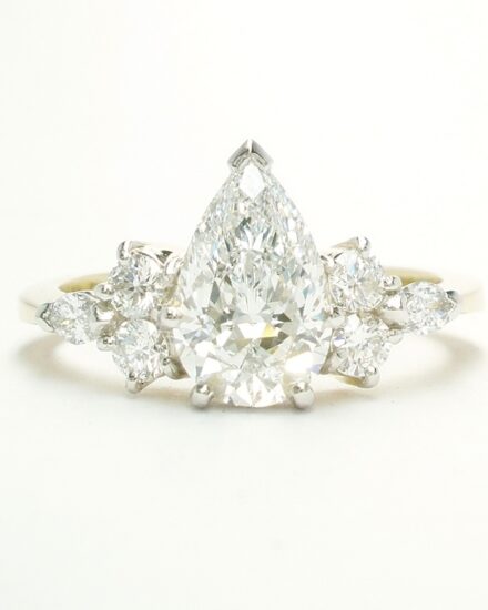 A 7 stone pear shaped, brilliant cut and marquise cut Lab grown diamond ring mounted in 18ct yellow gold and platinum.