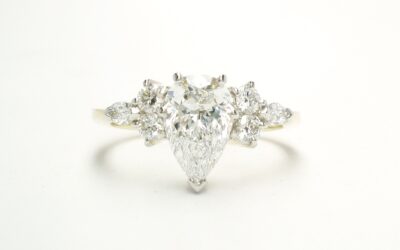 A 7 stone pear shaped, brilliant cut and marquise cut Lab grown diamond ring mounted in 18ct yellow gold and platinum.