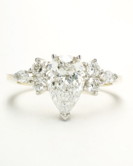 A 7 stone pear shaped, brilliant cut and marquise cut Lab grown diamond ring mounted in 18ct yellow gold and platinum.
