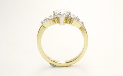 A 7 stone pear shaped, brilliant cut and marquise cut Lab grown diamond ring mounted in 18ct yellow gold and platinum.