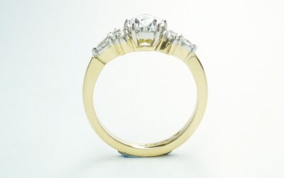 A 7 stone pear shaped, brilliant cut and marquise cut Lab grown diamond ring mounted in 18ct yellow gold and platinum.