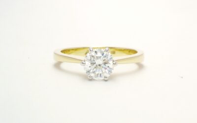 A single stone round brilliant cut Lab grown diamond ring mounted in 18ct. yellow gold and platinum