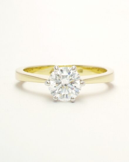 A single stone round brilliant cut Lab grown diamond ring mounted in 18ct. yellow gold and platinum