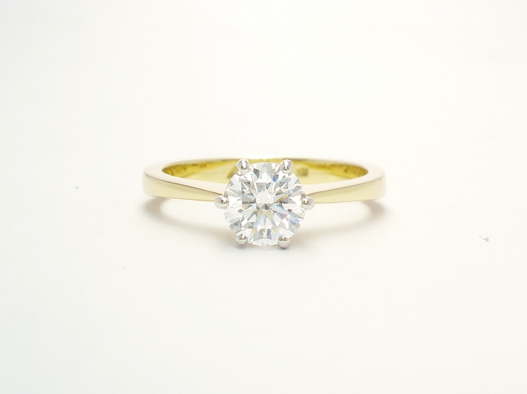 A single stone round brilliant cut Lab grown diamond ring mounted in 18ct. yellow gold and platinum
