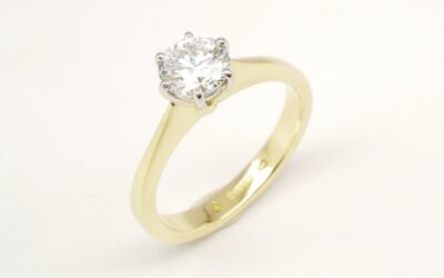 A single stone round brilliant cut Lab grown diamond ring mounted in 18ct. yellow gold and platinum