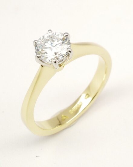 A single stone round brilliant cut Lab grown diamond ring mounted in 18ct. yellow gold and platinum