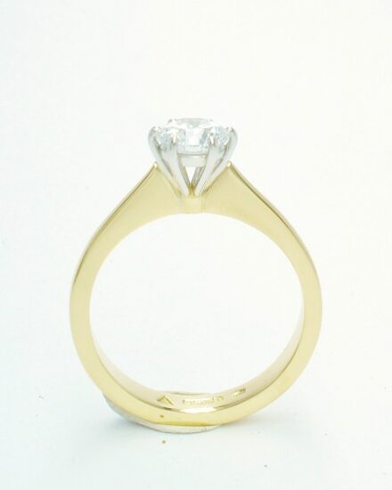 A single stone round brilliant cut Lab grown diamond ring mounted in 18ct. yellow gold and platinum